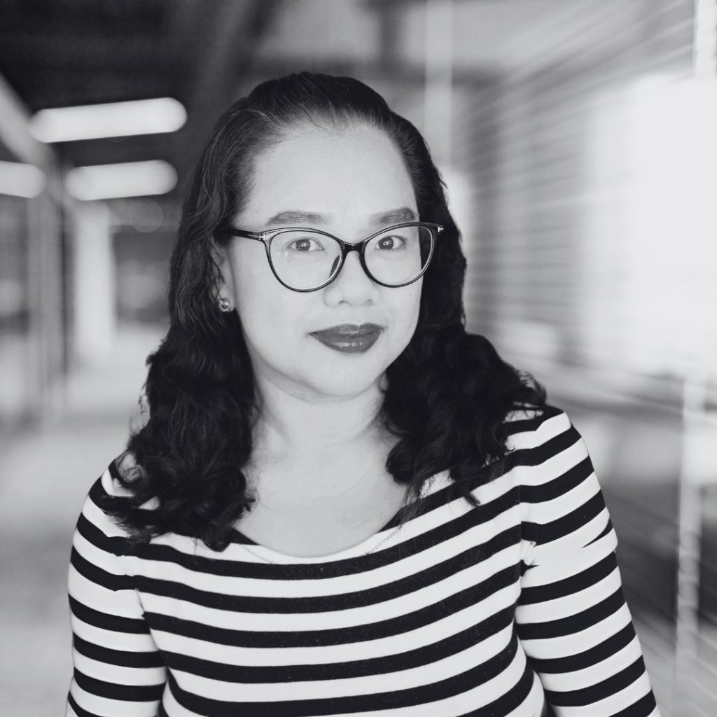 A photo of Ara Yu in black and white