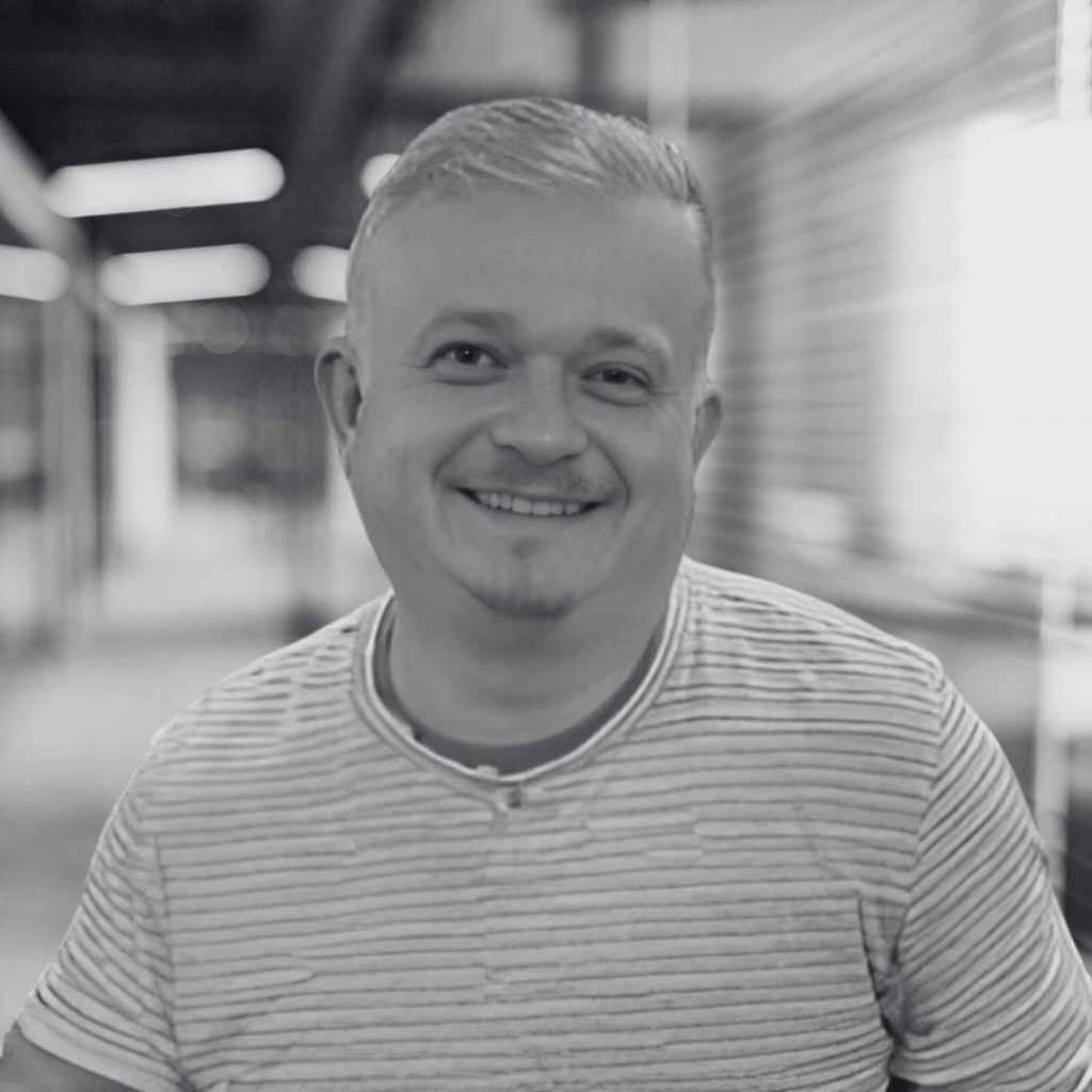 A photo of Kristof Wenecki in black and white