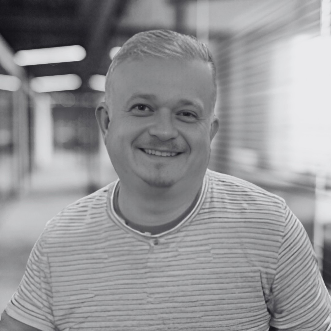 A photo of Kristof Wenecki in black and white