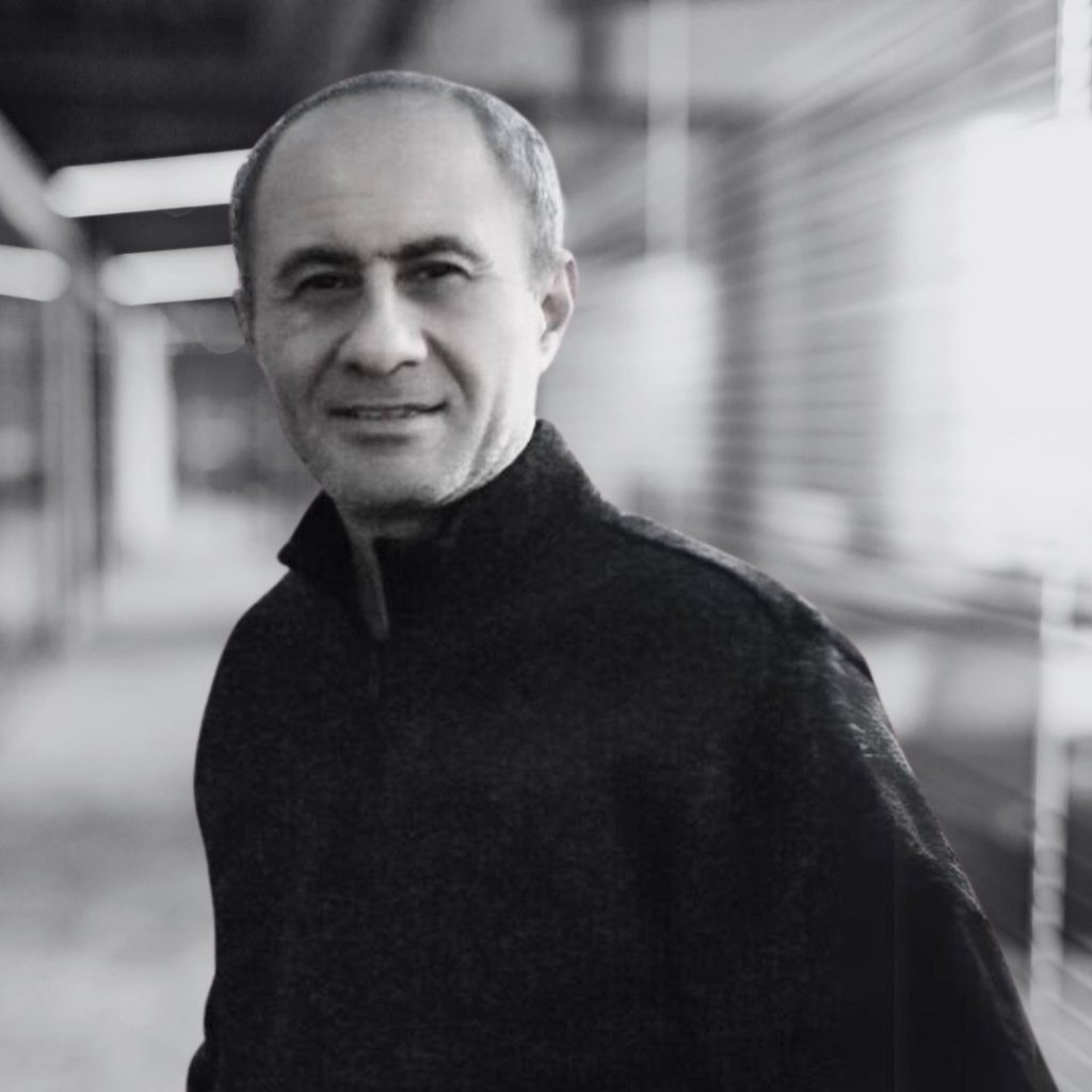 A photo of Omar Alshaher in black and white