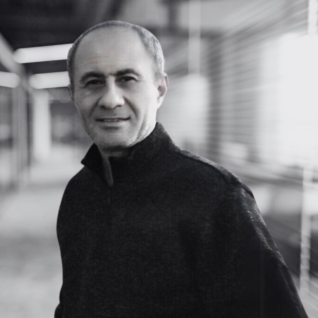 A photo of Omar Alshaher in black and white