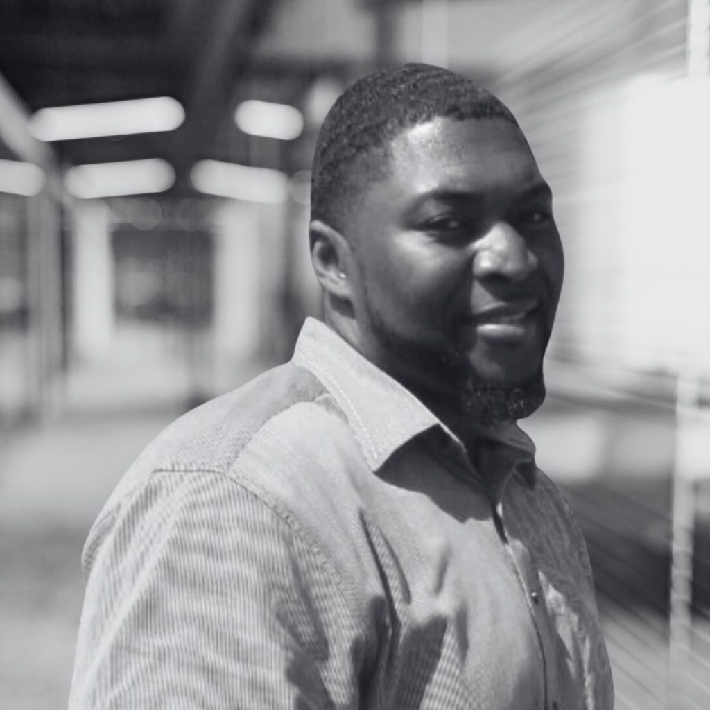 A photo of Luqman Smith in black and white